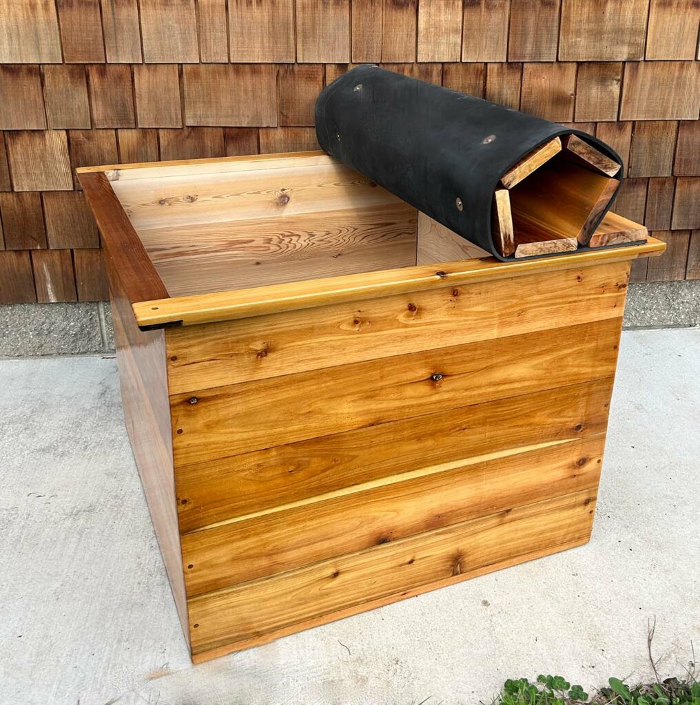 Outdoor cedar cold plunge tub with roll top